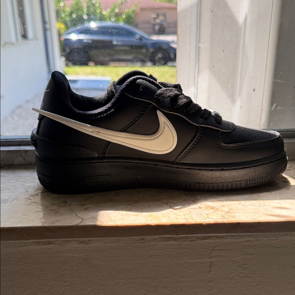Nike Black Low-Top Sneakers with White Swoosh Accent